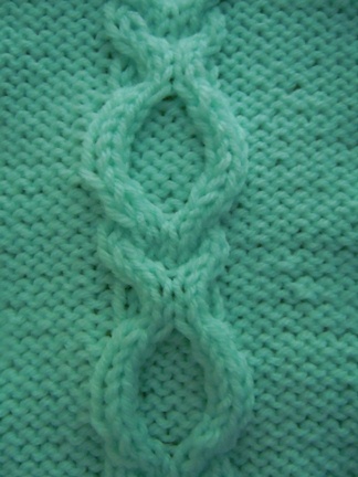 learn to knit the open ring cable stitch